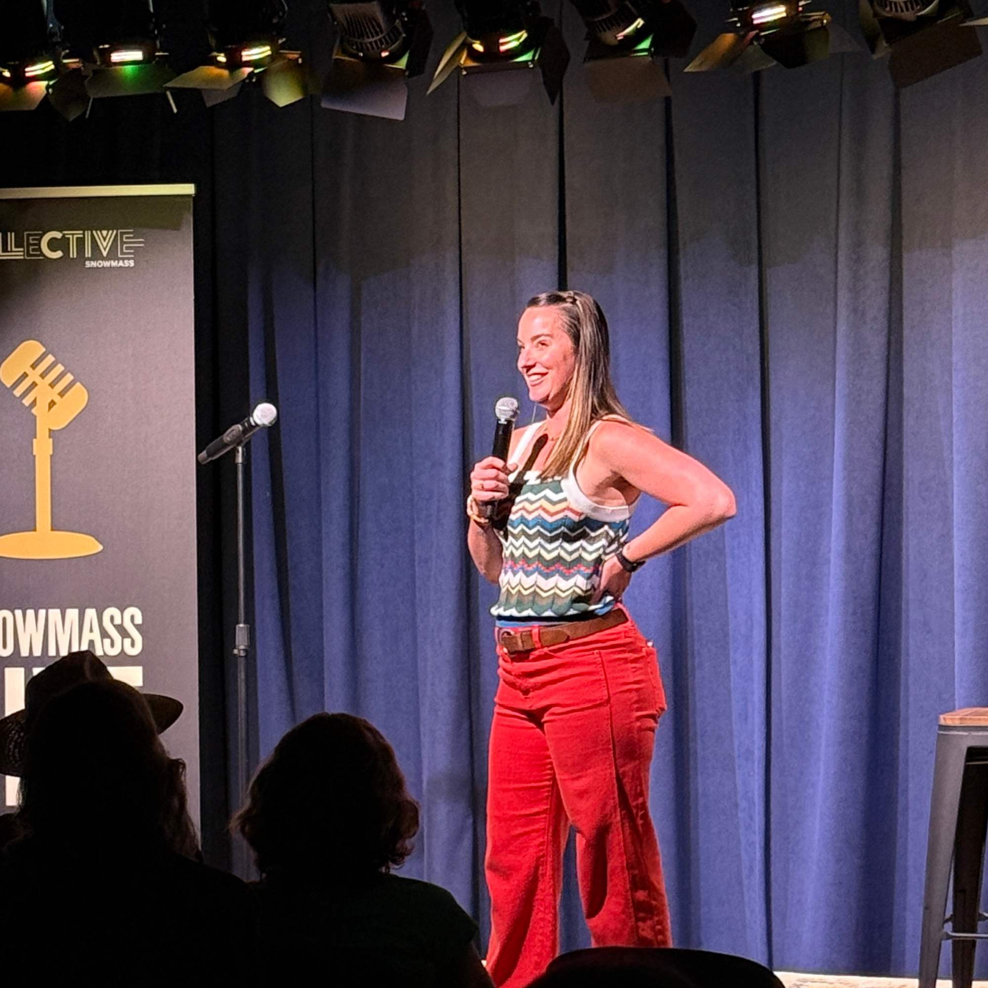 Comedian performing on The Collective Hall stage at the Snowmass Live Comedy Series, The Collective Snowmass