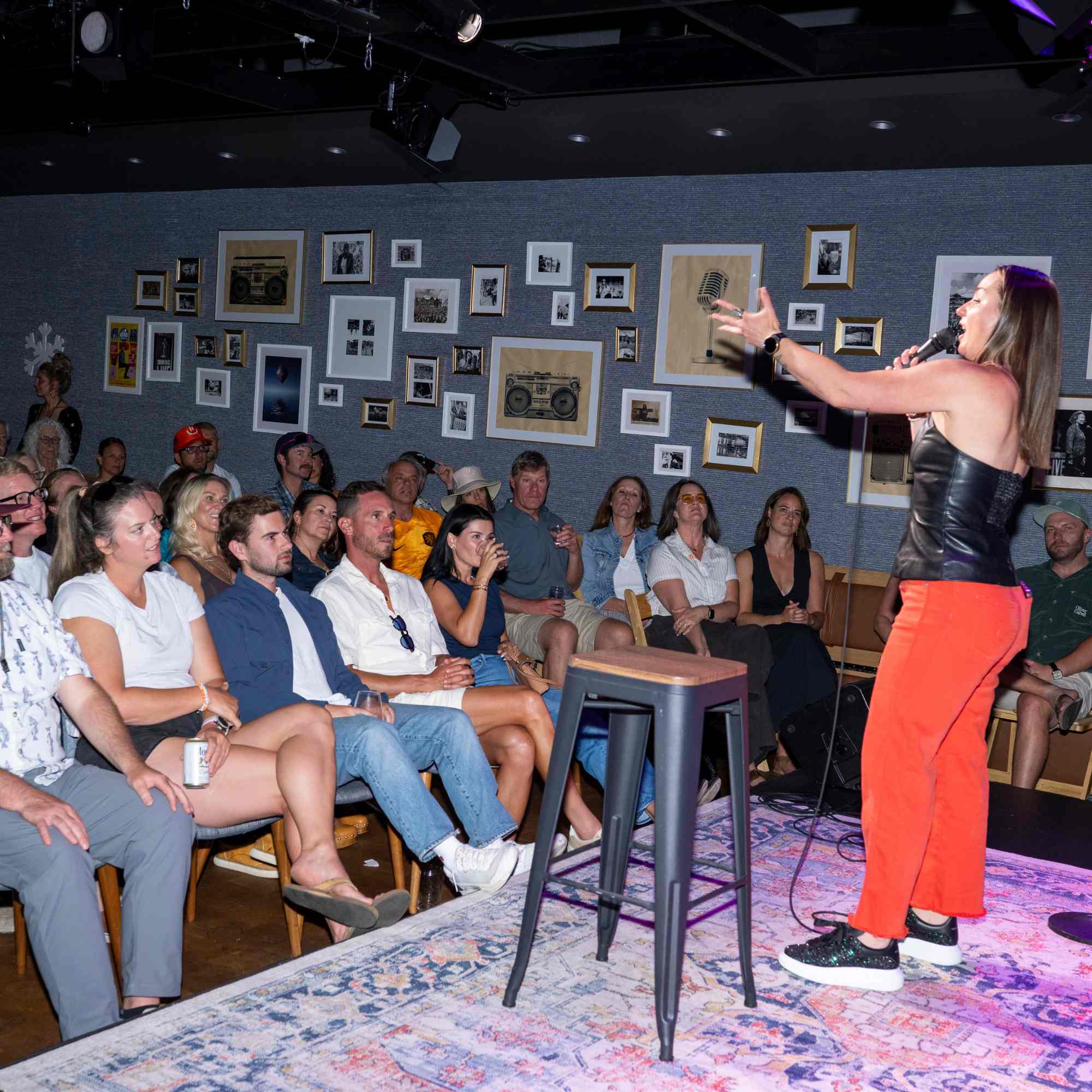 Comedian performing to a full house in The Collective Hall at Snowmass Live Comedy WKND!, The Collective Snowmass
