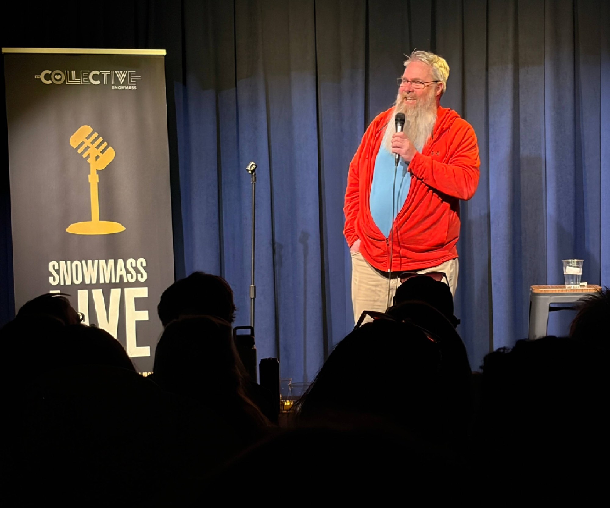 Comedian on stage at Snowmass Live in The Collective Hall, The Collective Snowmass